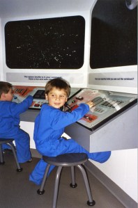 Joe and Luke playing astronaut at the museum six years ago